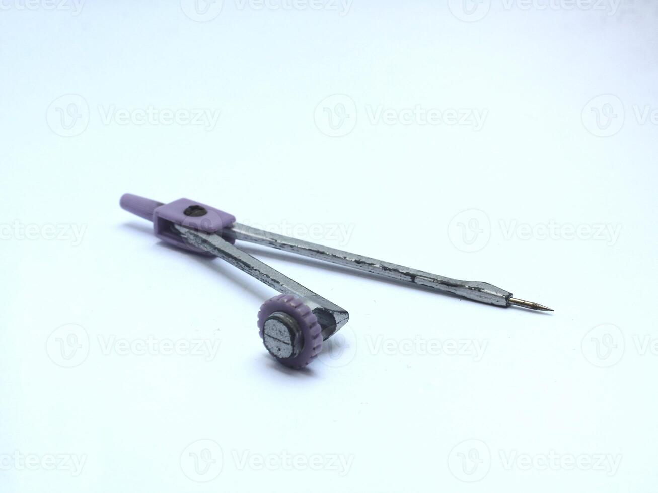 precision compass circle making tool made of metal isolated on white background photo
