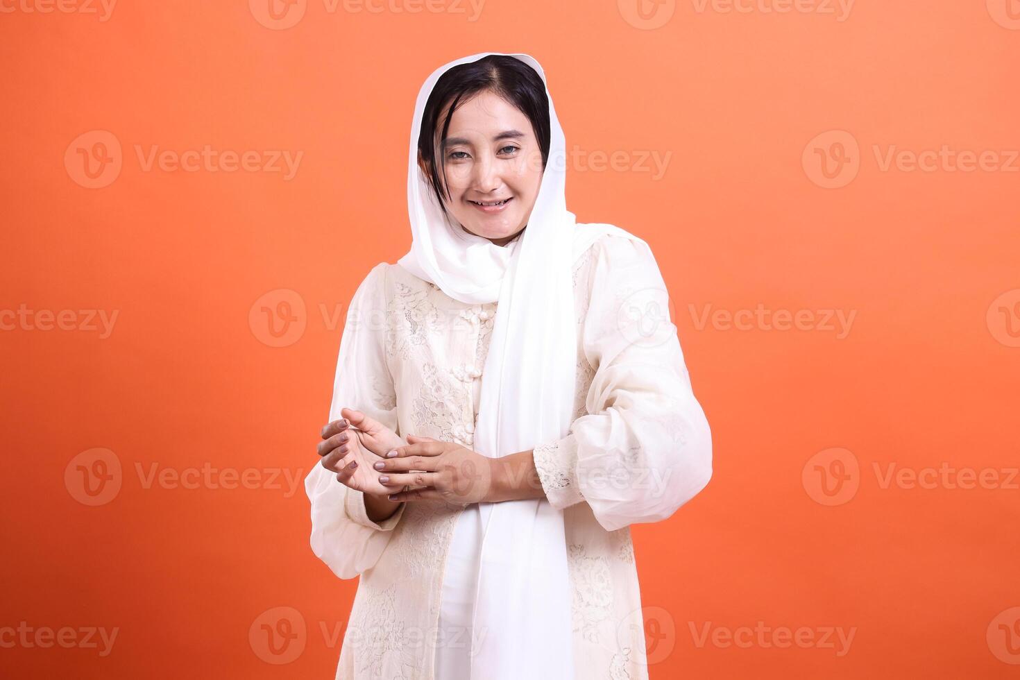 Smiling Woman in White Hijab, A portrait of inner peace and cult photo
