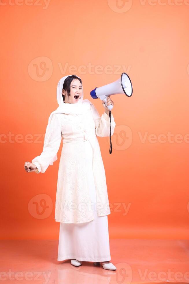 Determined woman with megaphone broadcasting powerful message, s photo