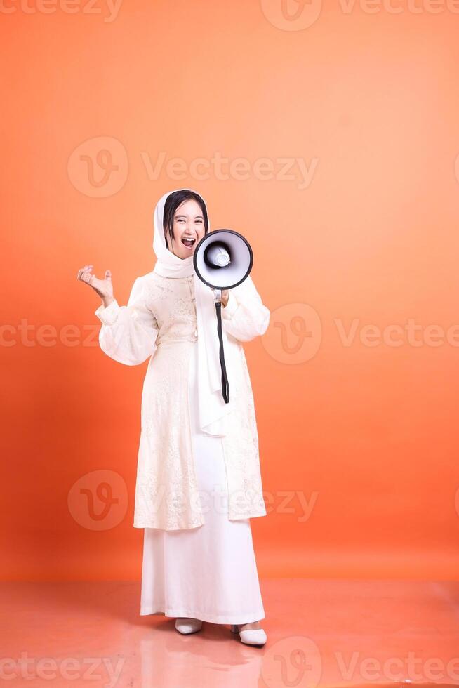 Amplifying Her Voice, Modern Muslim Woman with Megaphone Communi photo