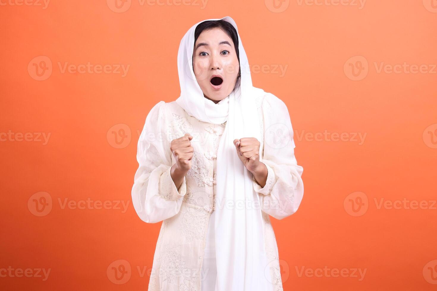 Astonished muslimah, portrait of a woman with a headscarf expres photo