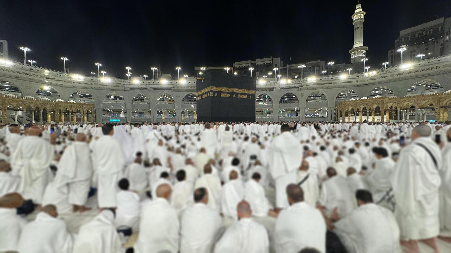 Muslim pilgrims perform Tawaf around the Kaaba after dawn prayer at Masjid al-Haram in Makkah. Translation. Praise be to Allah Who created the heavens and the earth and made the darkness and the light photo