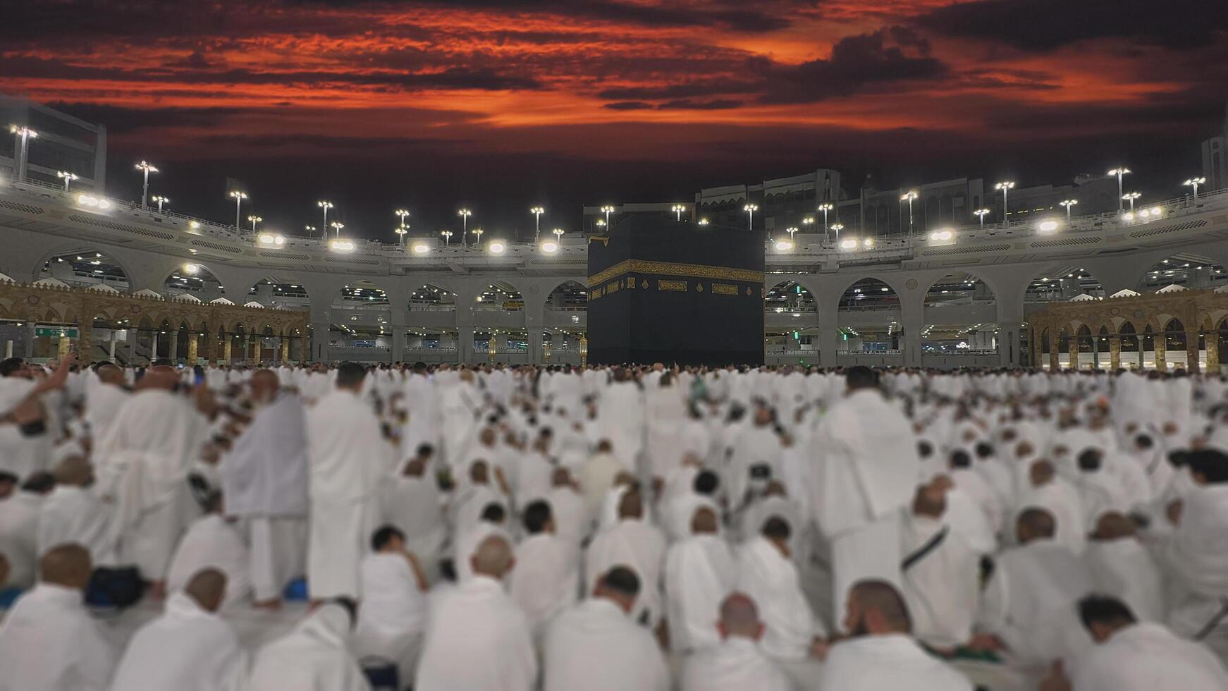 Muslim pilgrims perform Tawaf around the Kaaba after dawn prayer at Masjid al-Haram in Makkah. Translation. Praise be to Allah Who created the heavens and the earth and made the darkness and the light photo