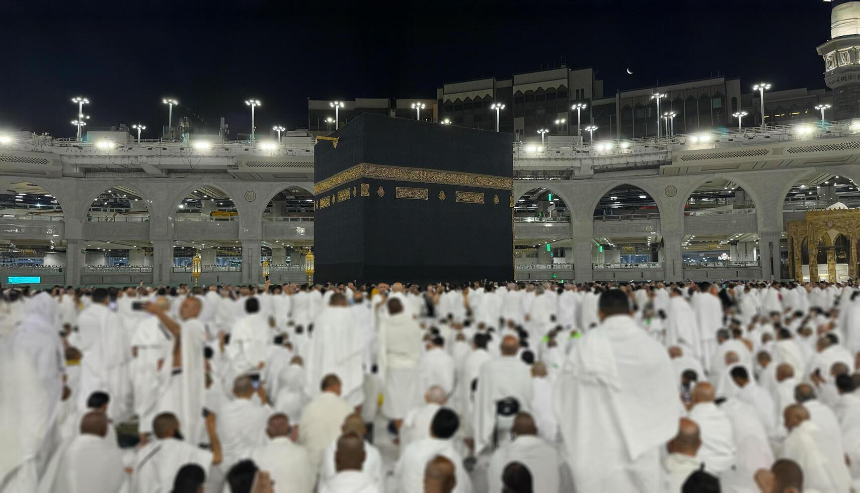 Muslim pilgrims perform Tawaf around the Kaaba after dawn prayer at Masjid al-Haram in Makkah. Translation. Praise be to Allah Who created the heavens and the earth and made the darkness and the light photo