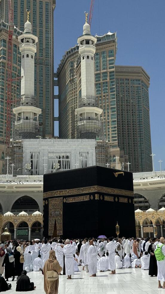 Muslim pilgrims perform Tawaf around the Kaaba after dawn prayer at Masjid al-Haram in Makkah. Translation. Praise be to Allah Who created the heavens and the earth and made the darkness and the light photo