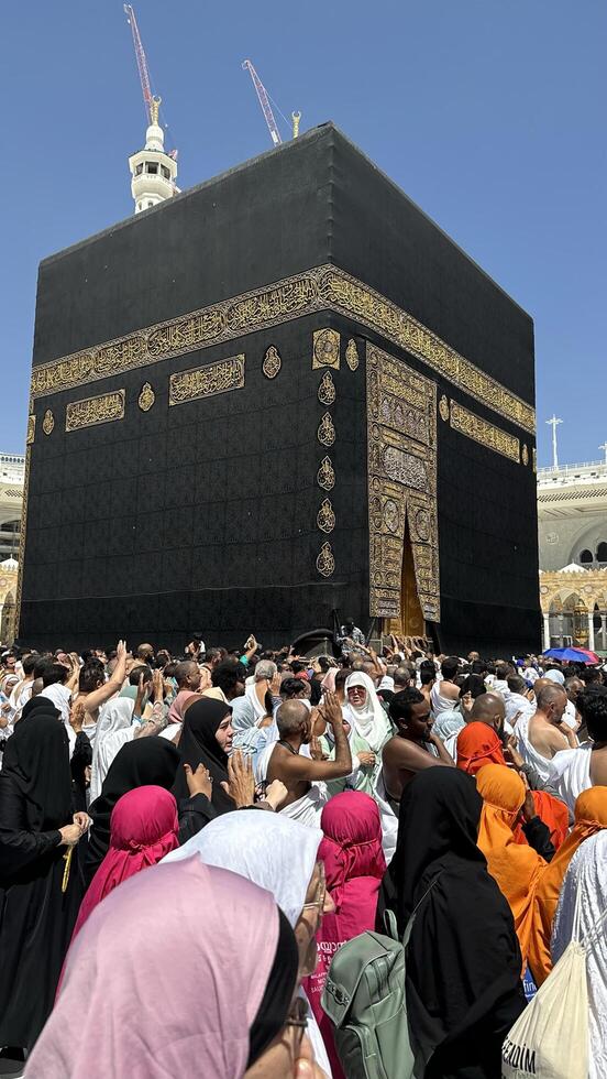 Muslim pilgrims perform Tawaf around the Kaaba after dawn prayer at Masjid al-Haram in Makkah. Translation. Praise be to Allah Who created the heavens and the earth and made the darkness and the light photo