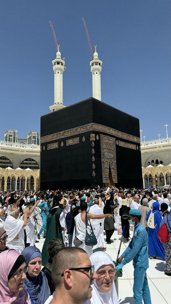 Muslim pilgrims perform Tawaf around the Kaaba after dawn prayer at Masjid al-Haram in Makkah. Translation. Praise be to Allah Who created the heavens and the earth and made the darkness and the light photo