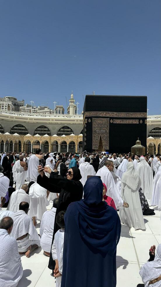 Muslim pilgrims perform Tawaf around the Kaaba after dawn prayer at Masjid al-Haram in Makkah. Translation. Praise be to Allah Who created the heavens and the earth and made the darkness and the light photo