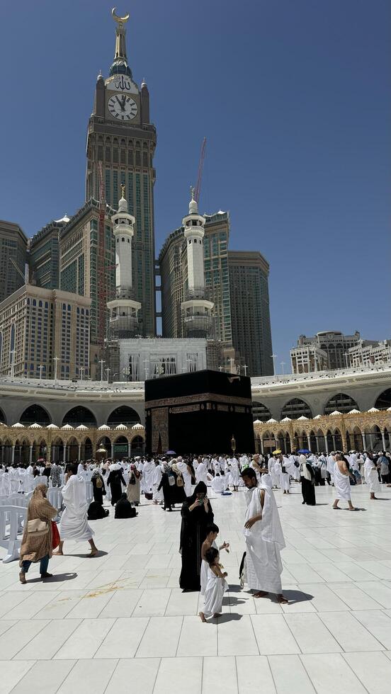 Muslim pilgrims perform Tawaf around the Kaaba after dawn prayer at Masjid al-Haram in Makkah. Translation. Praise be to Allah Who created the heavens and the earth and made the darkness and the light photo