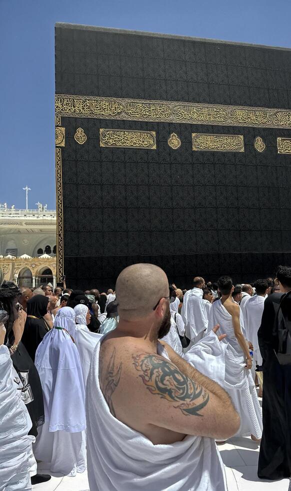 Muslim pilgrims perform Tawaf around the Kaaba after dawn prayer at Masjid al-Haram in Makkah. Translation. Praise be to Allah Who created the heavens and the earth and made the darkness and the light photo