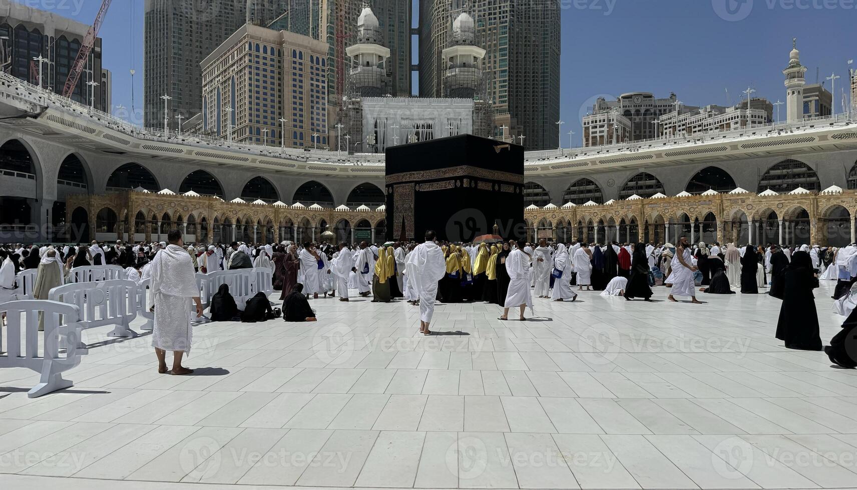 Muslim pilgrims perform Tawaf around the Kaaba after dawn prayer at Masjid al-Haram in Makkah, Saudi Arabia. Muslims worldwide face the Kaaba in prayer, symbolizing unity and devotion in Islam photo