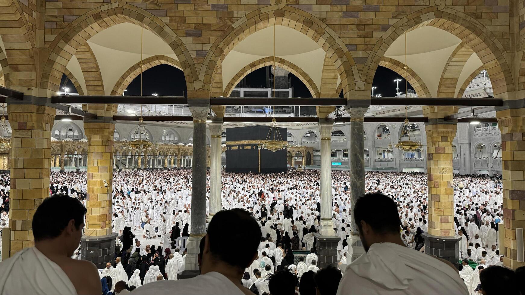 Muslim pilgrims perform Tawaf around the Kaaba after dawn prayer at Masjid al-Haram in Makkah. Translation. Praise be to Allah Who created the heavens and the earth and made the darkness and the light photo