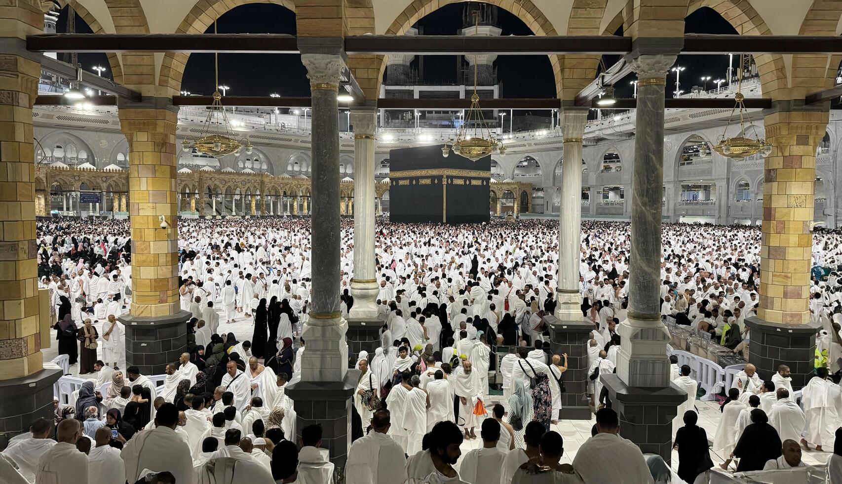 Muslim pilgrims perform Tawaf around the Kaaba after dawn prayer at Masjid al-Haram in Makkah. Translation. Praise be to Allah Who created the heavens and the earth and made the darkness and the light photo