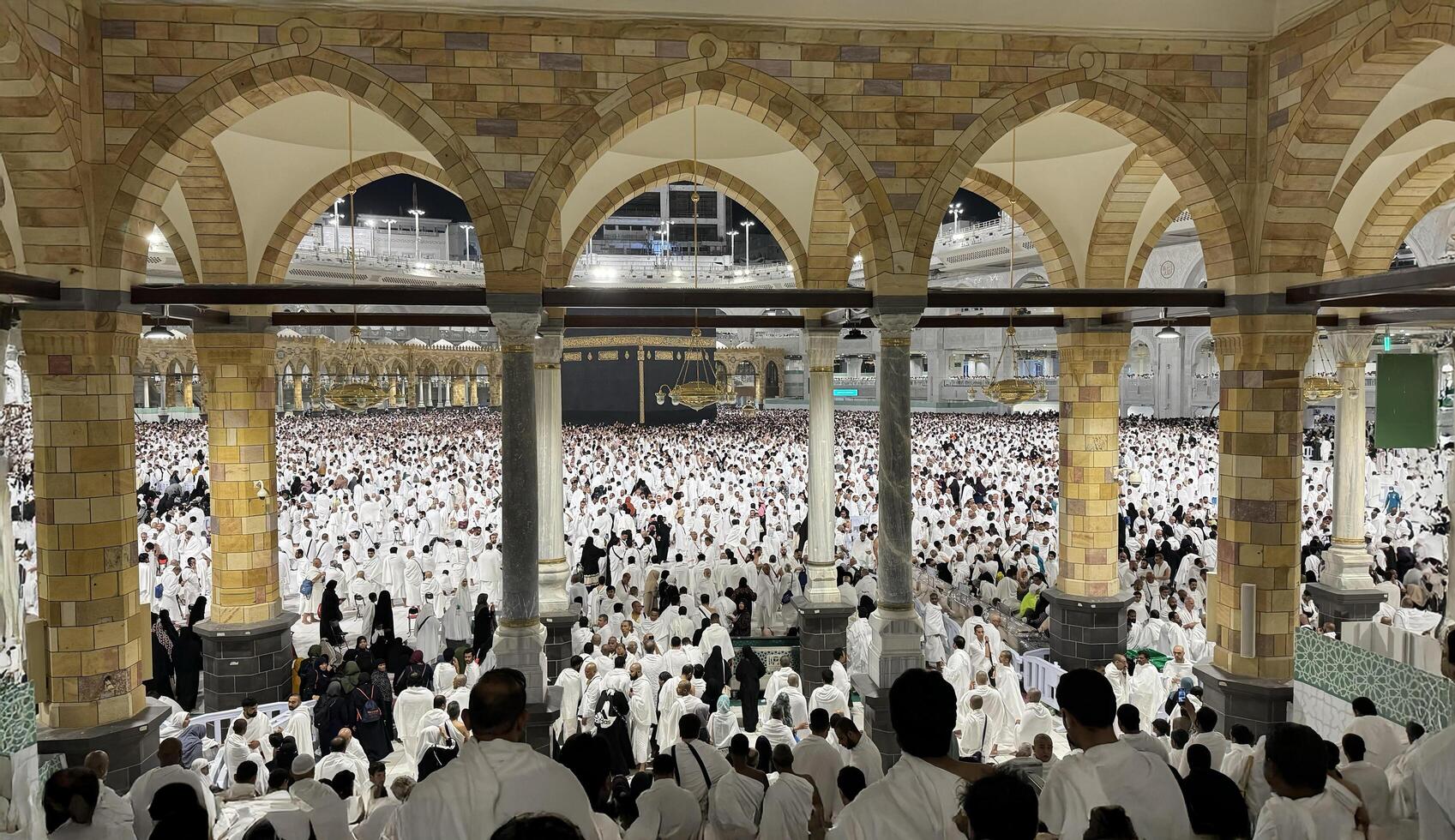 Muslim pilgrims perform Tawaf around the Kaaba after dawn prayer at Masjid al-Haram in Makkah. Translation. Praise be to Allah Who created the heavens and the earth and made the darkness and the light photo