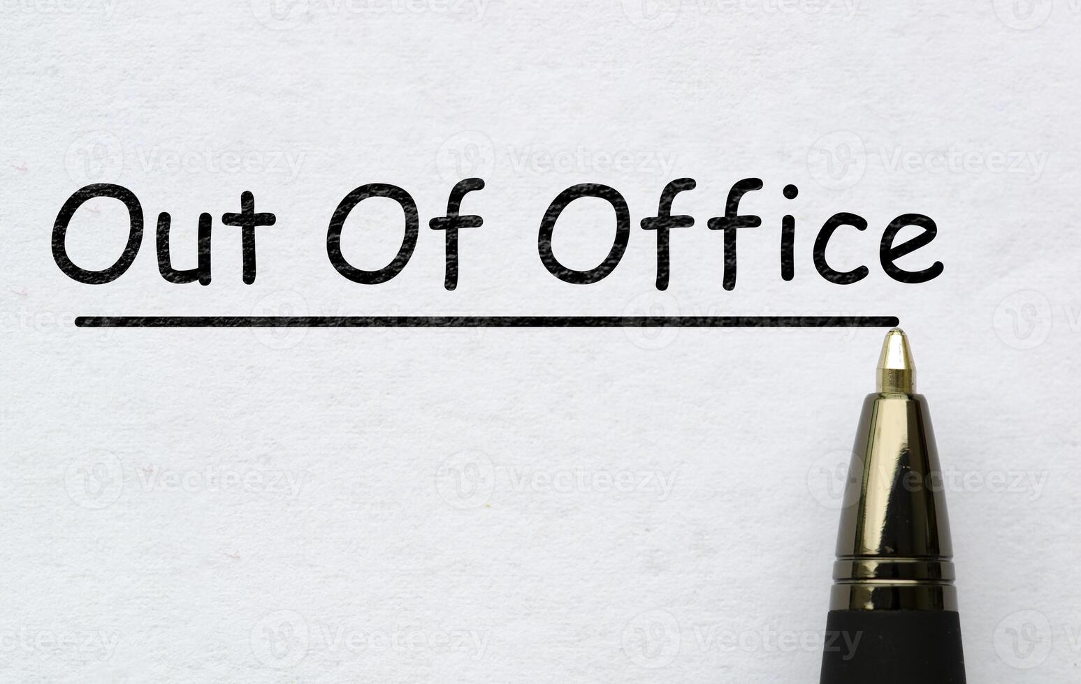 Out of office text on white paper. Vacation concept photo