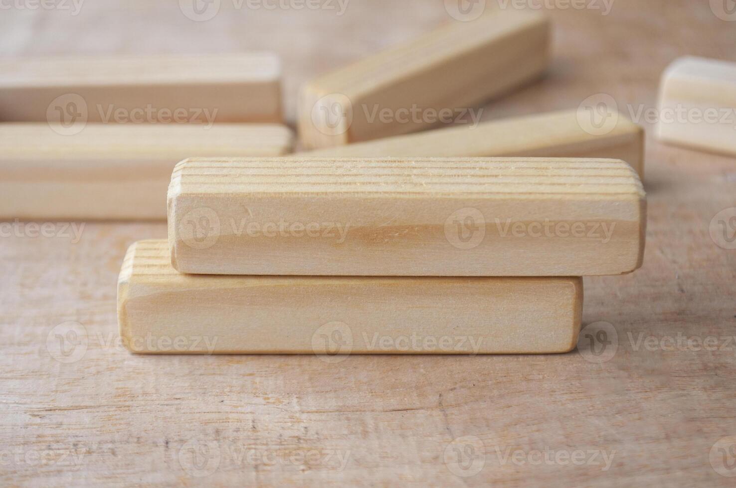 Wooden blocks on wooden table with customizable space for text. Copy space concept. photo