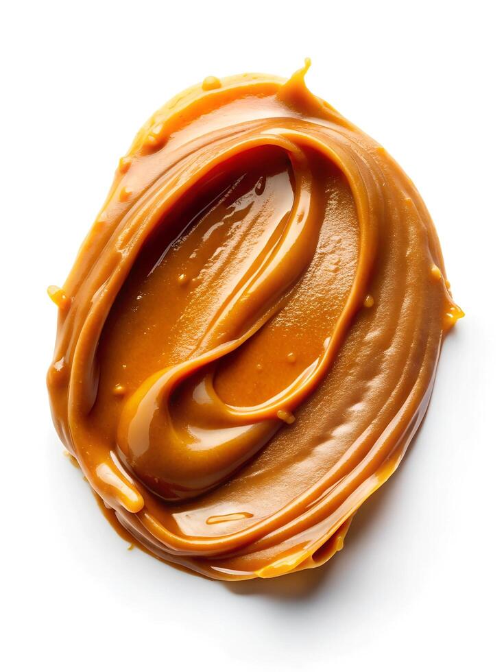 Smear of tasty caramel paste on white background, top view photo