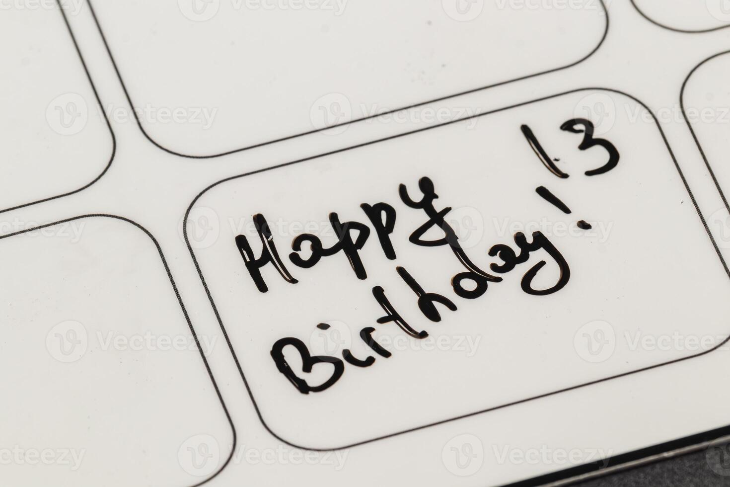 Creative birthday message written on a label with a black marker photo