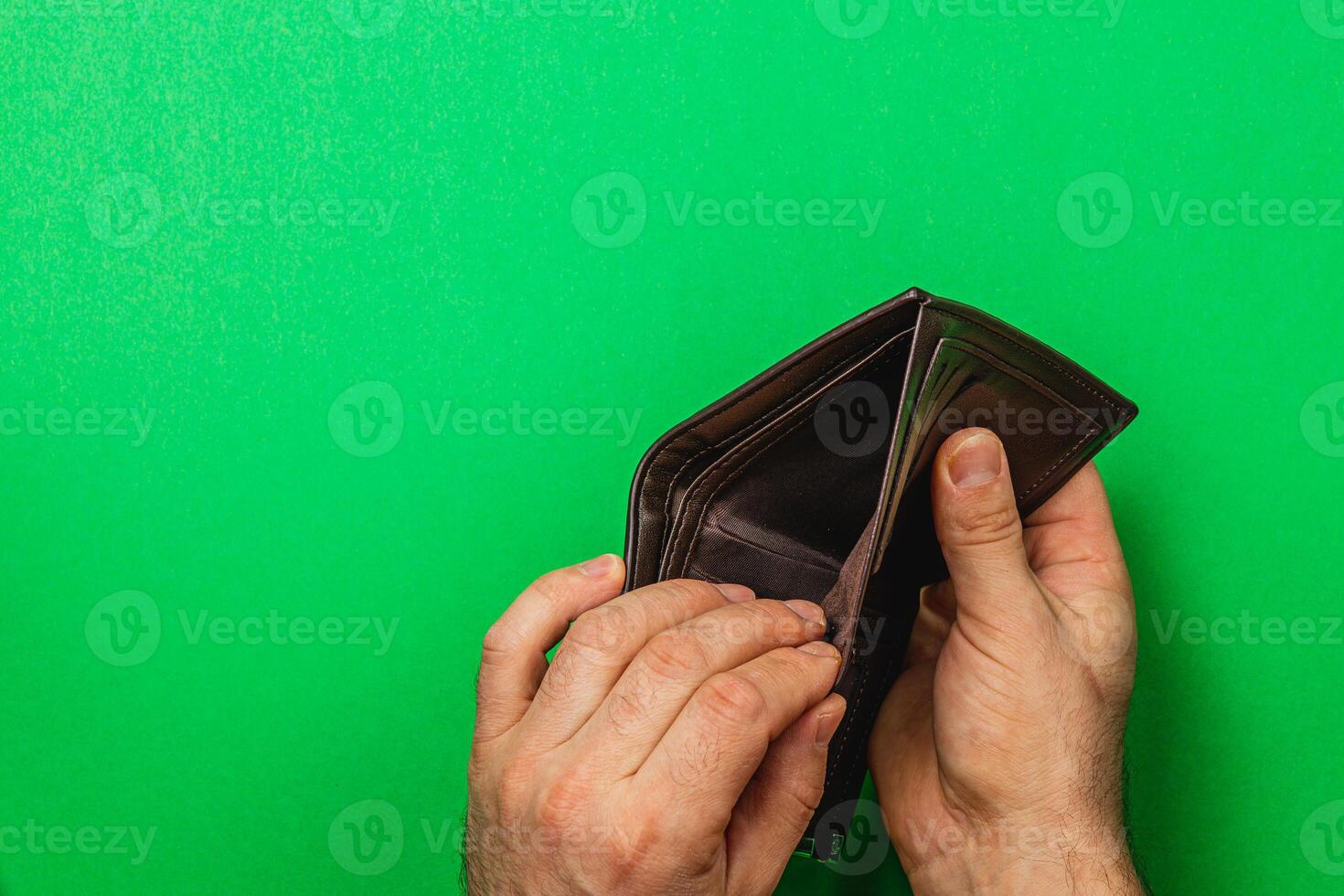 Despair over empty wallet during financial crisis for a businessman photo
