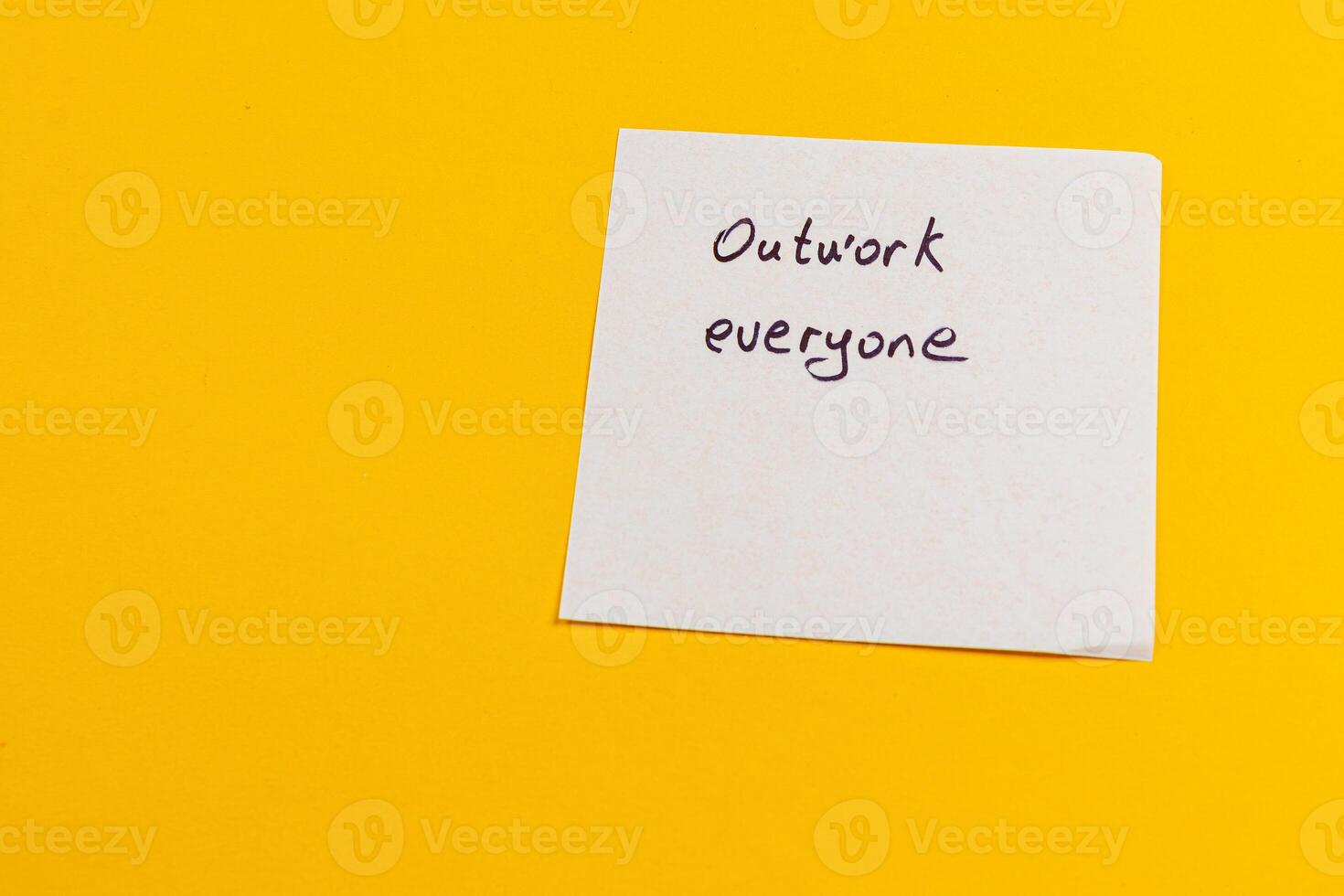 Reminder note promotes collaboration and effort in a bright workspace photo