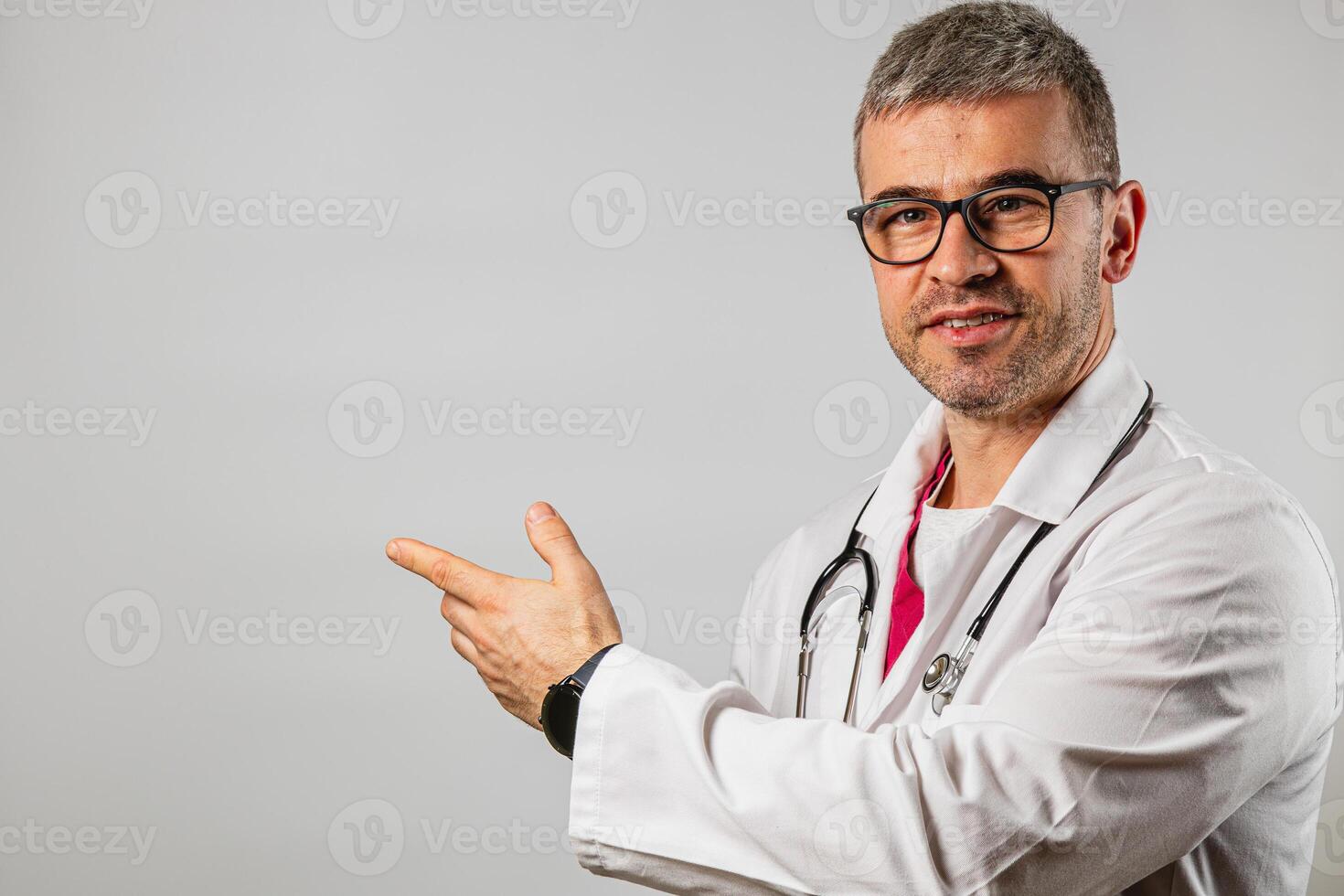 Doctor presenting information with a confident smile in a clinical setting photo