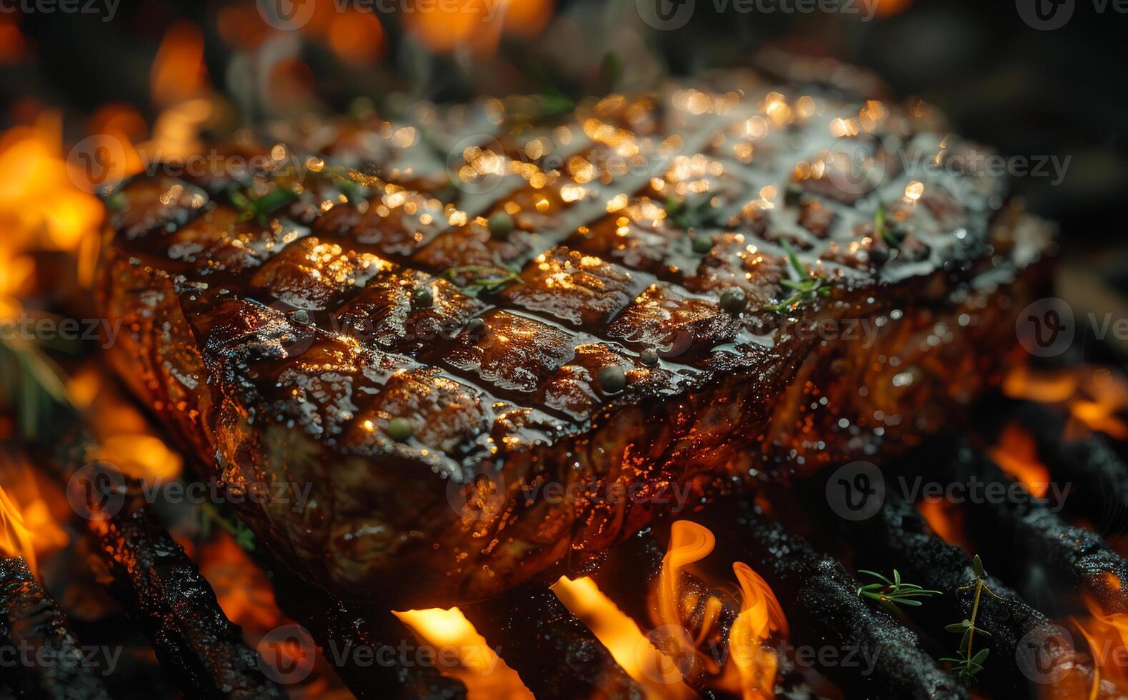 Beef steak on the grill with flames. photo