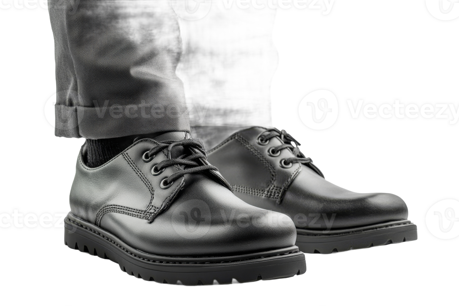 Stylish black shoes worn with gray pants in a casual setting png
