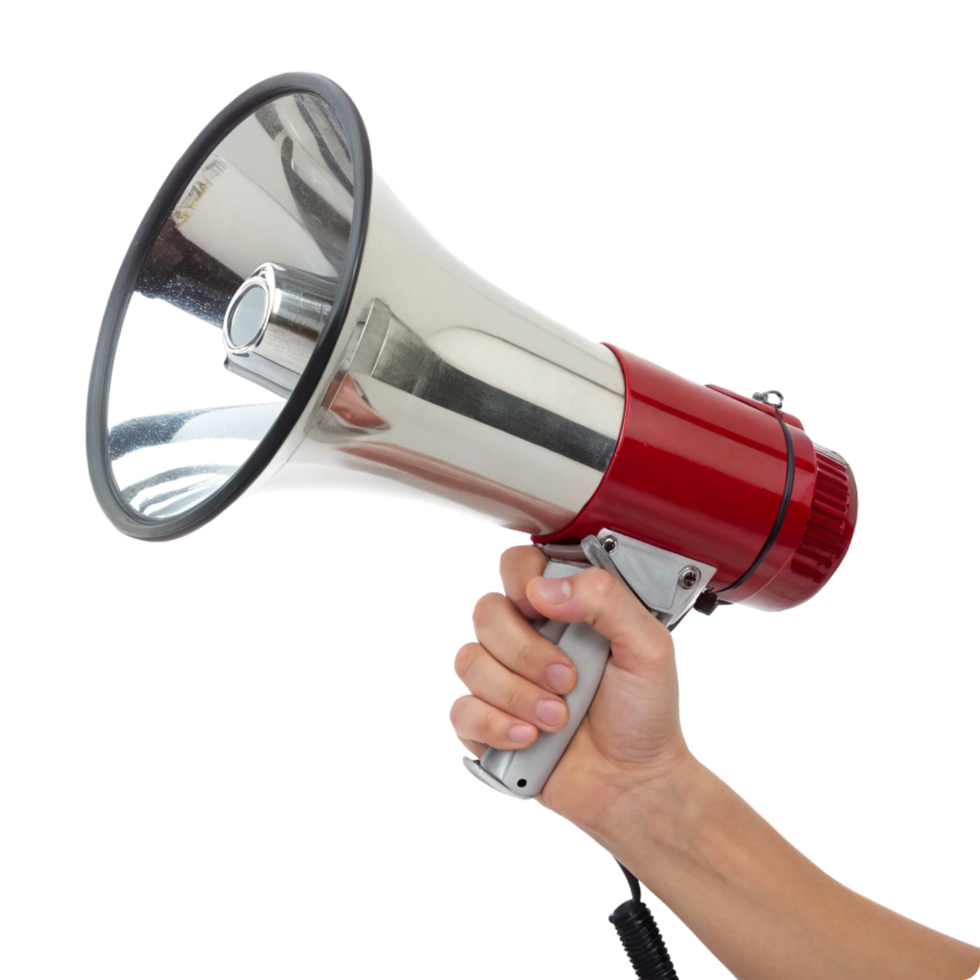 A hand holding a red and silver megaphone against a black background png