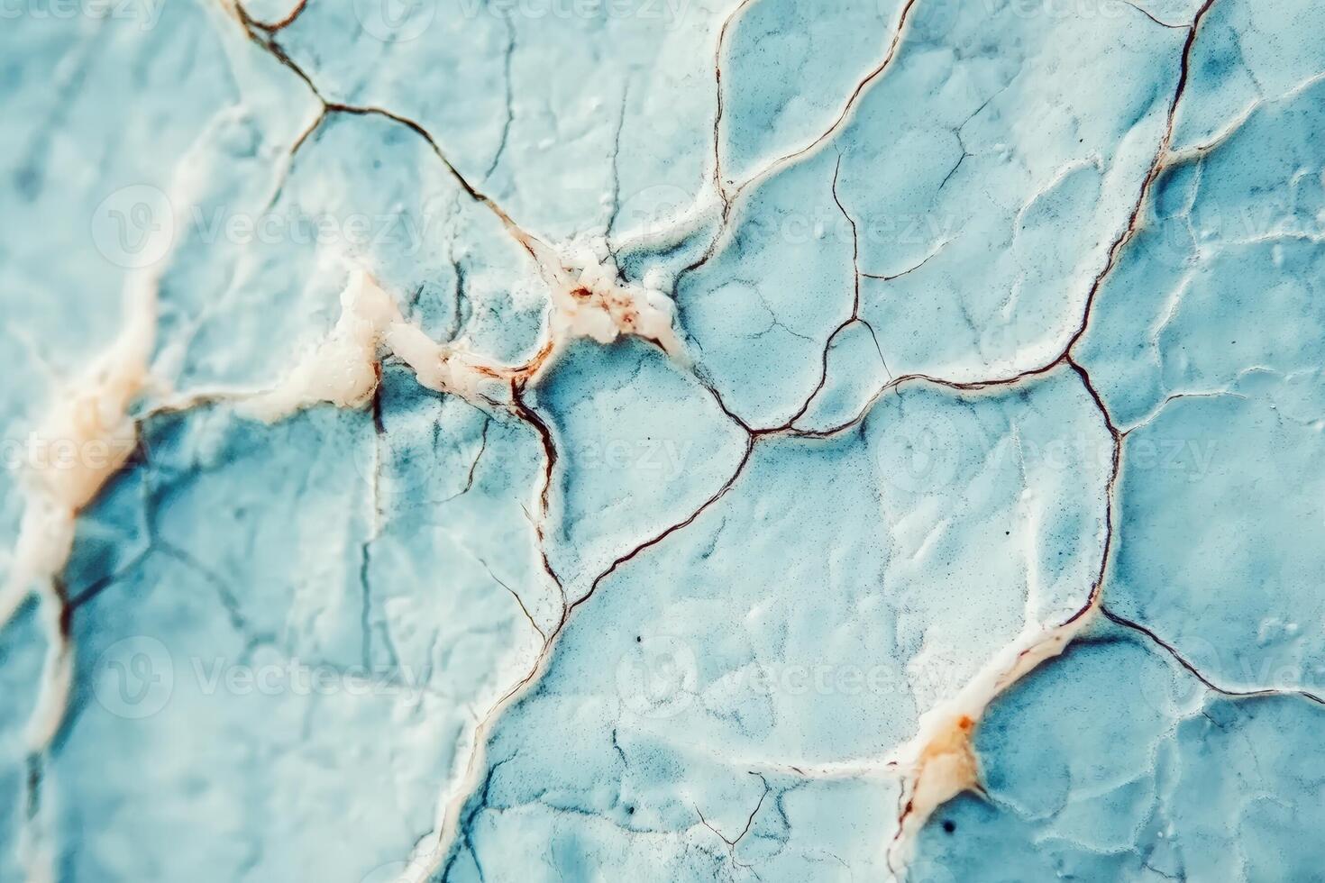 A close up of a blue marble surface with cracks photo