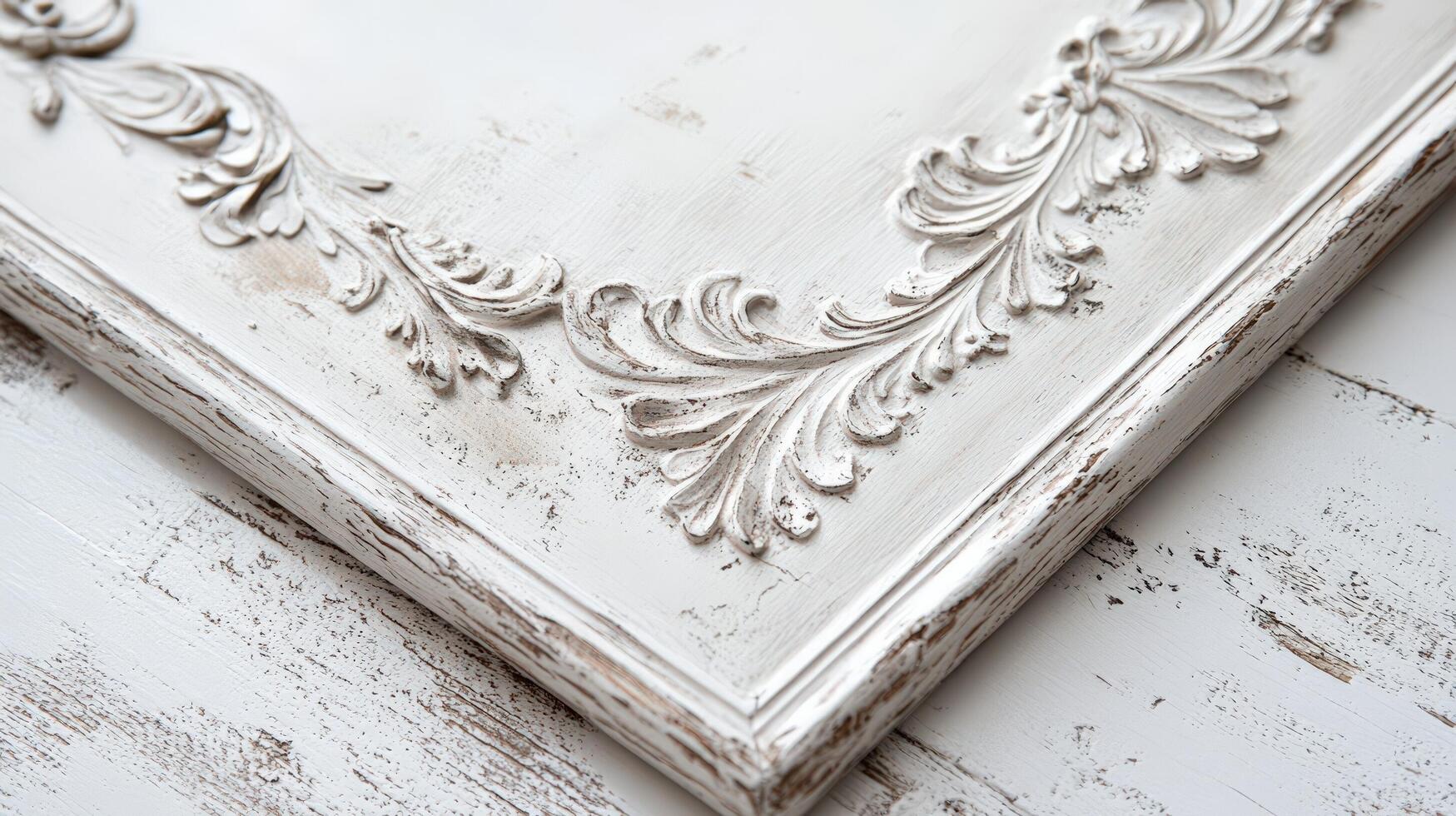 A white frame with ornate designs on it photo