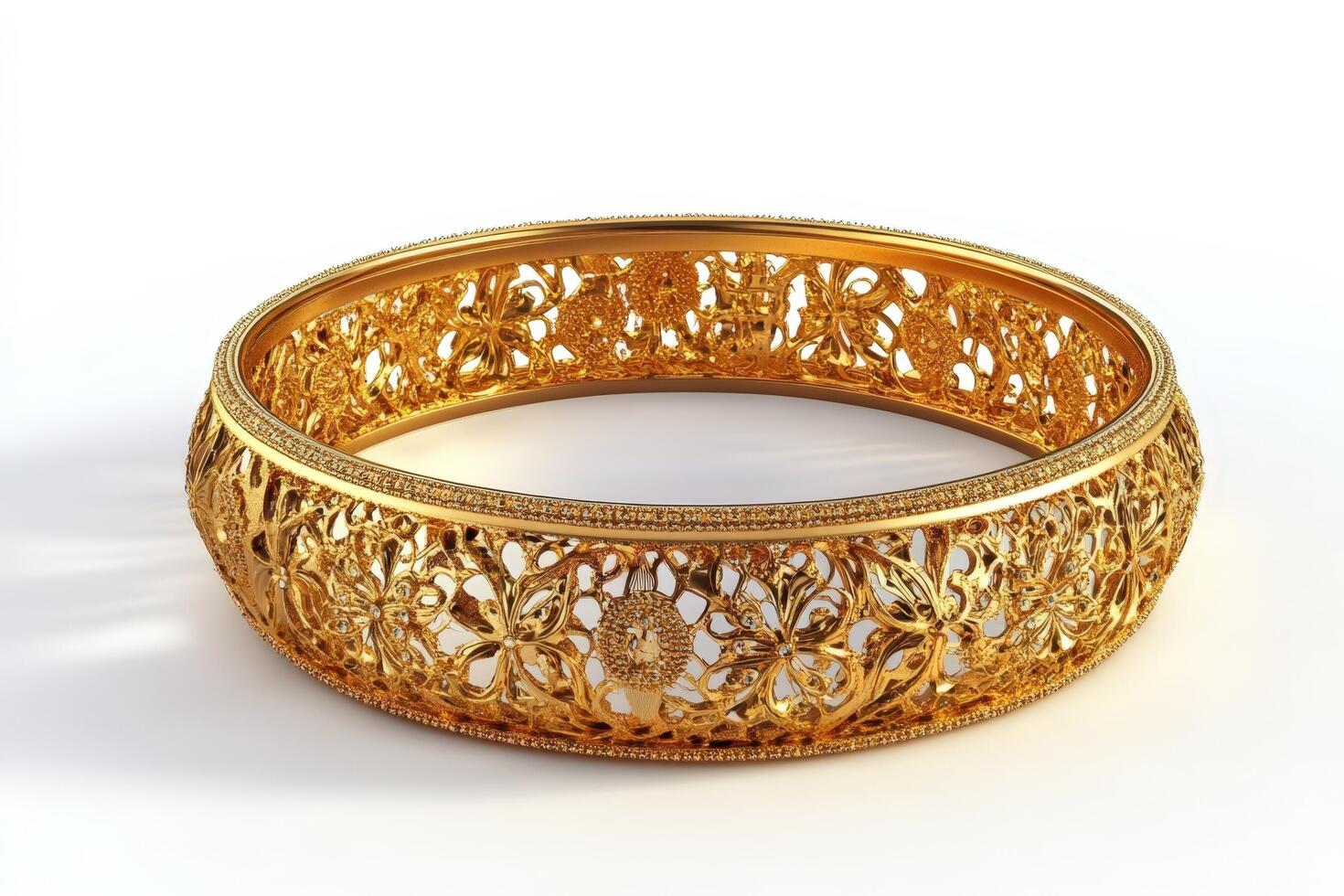 Gold bangle bracelet with intricate design photo