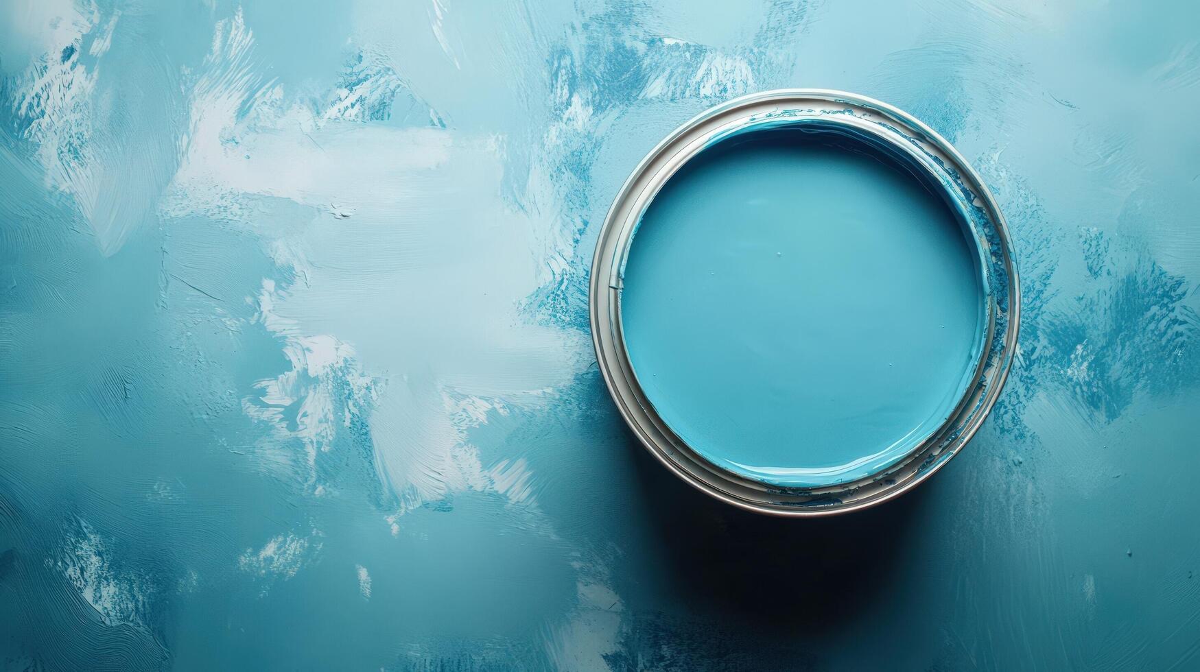 A Can of Light Blue Paint on a Painted Surface photo