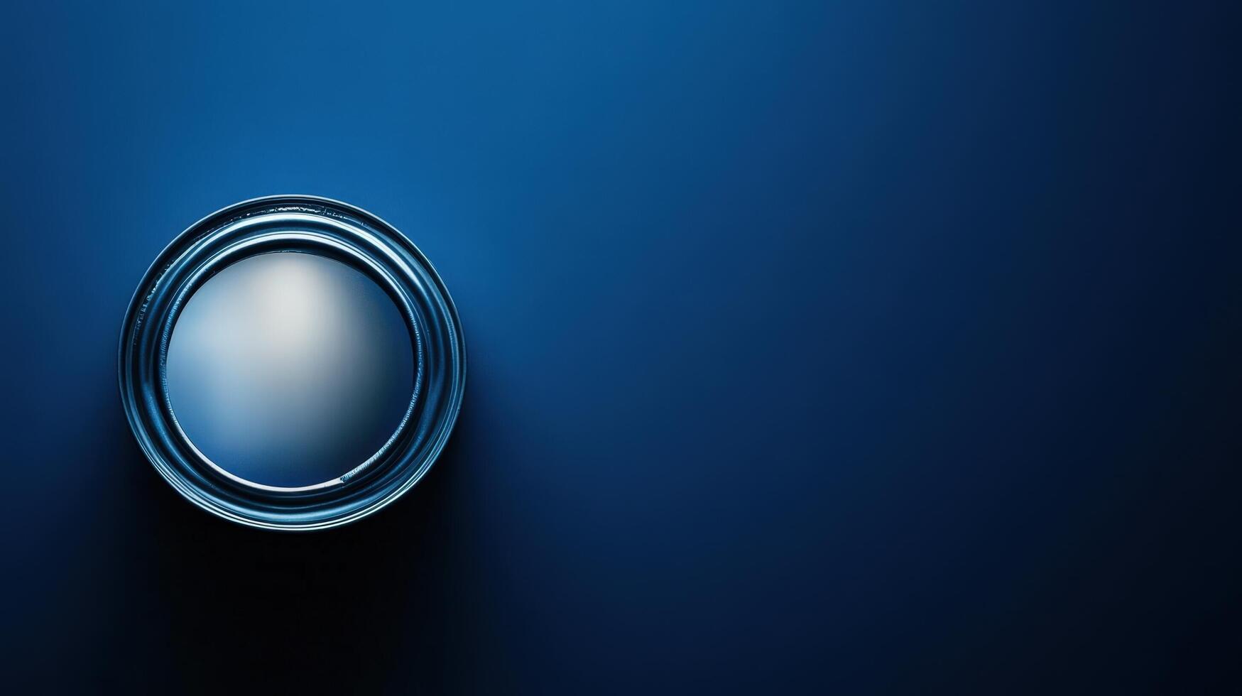 A dark blue paint can sits on a matching background photo