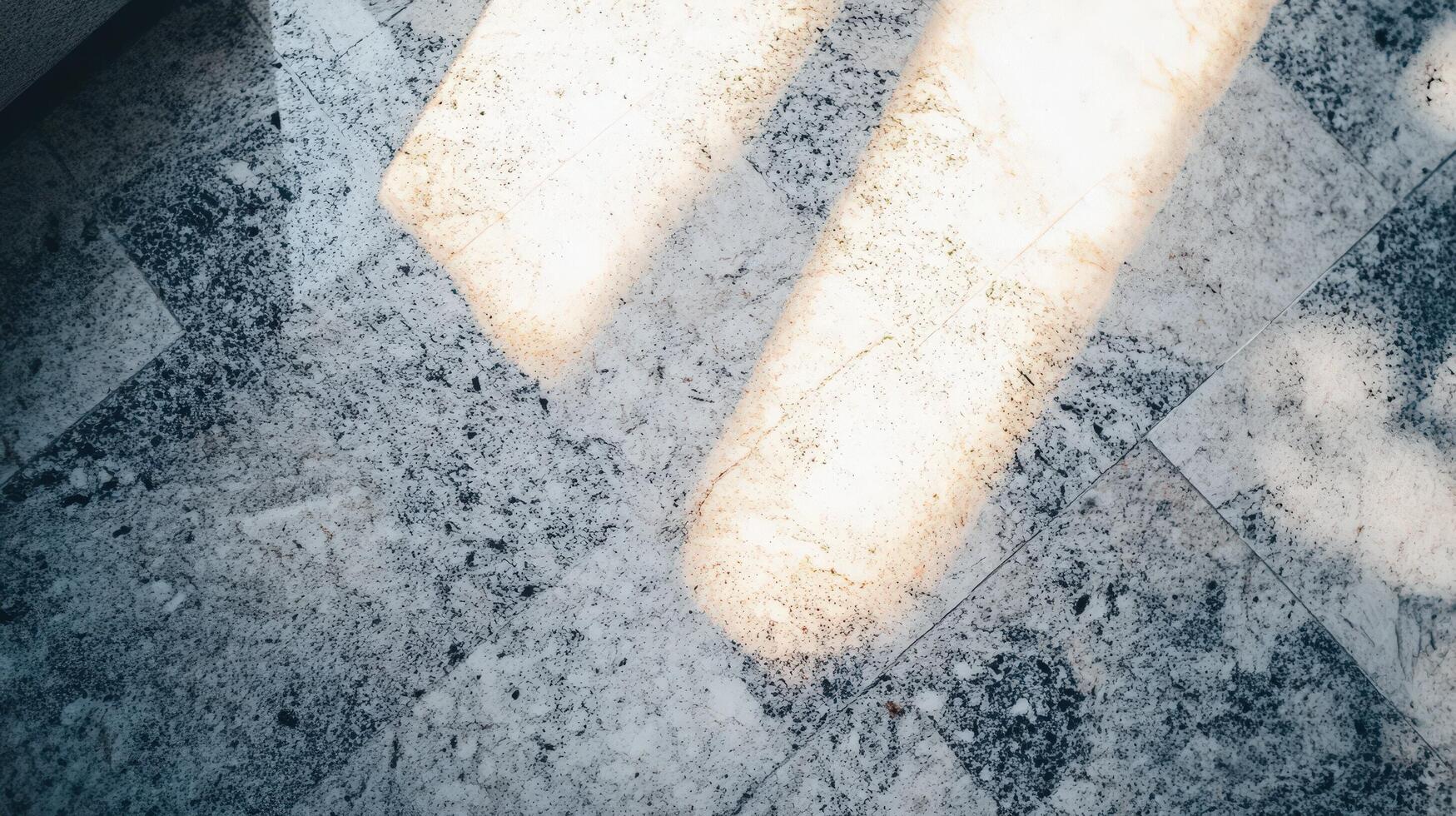 Light Illuminates Textured Stone Floor Surface photo