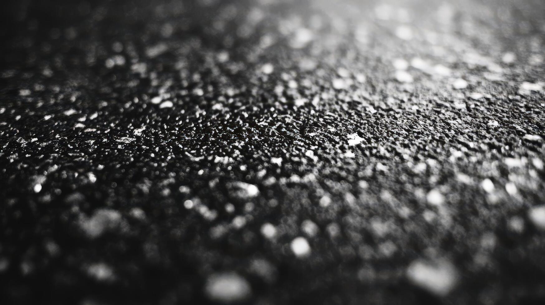 Abstract Black Surface with Glimmering Particles photo