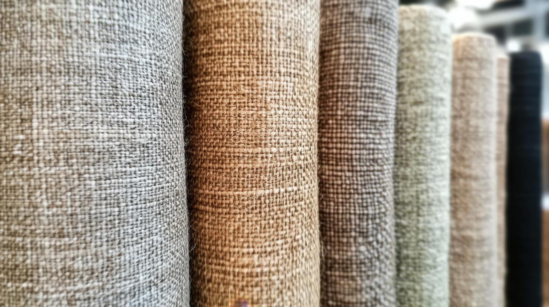 Rolled Fabric Samples Displaying Various Textures and Colors photo