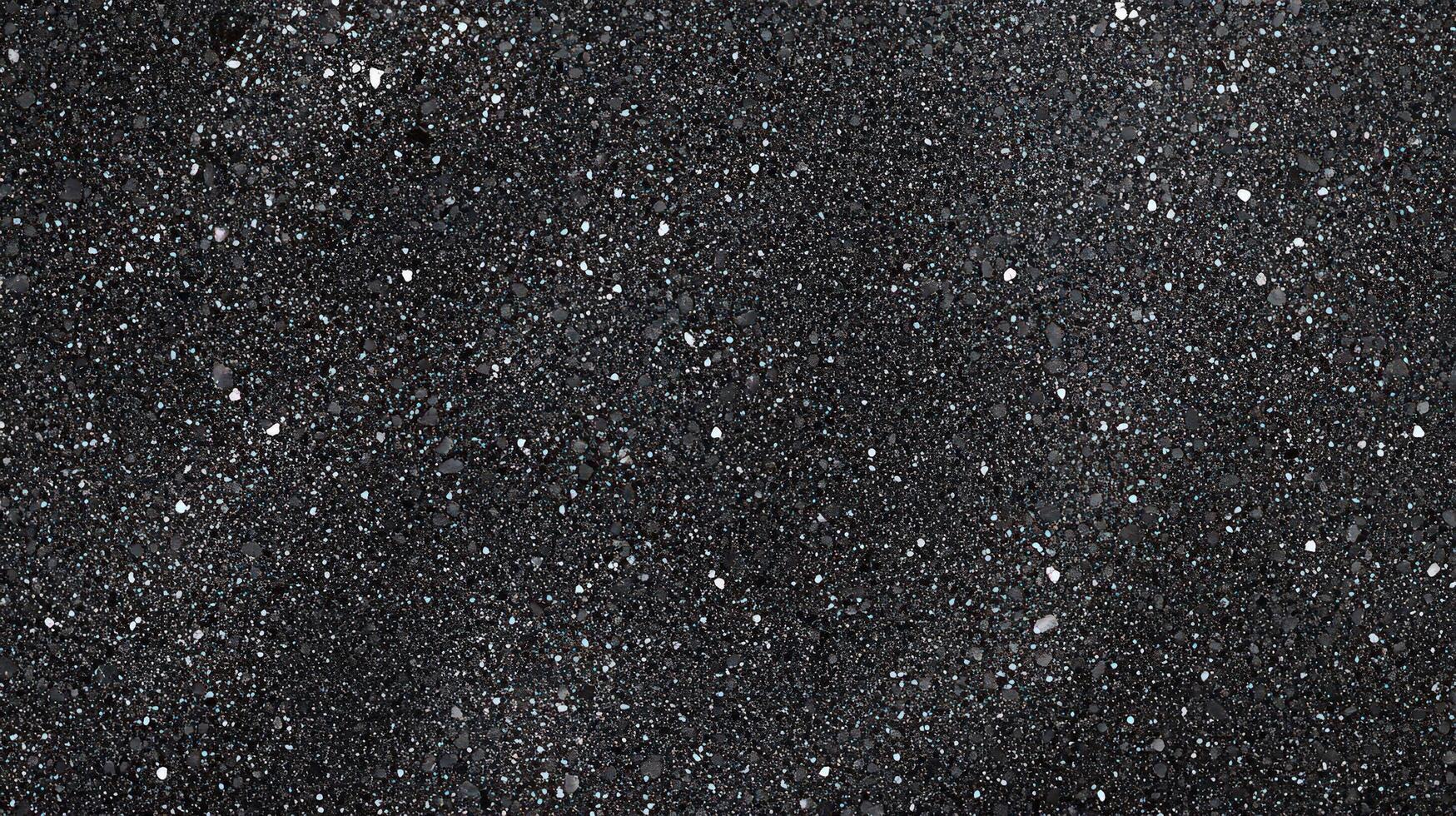 Black Glitter Background With Tiny Sparkling Particles photo