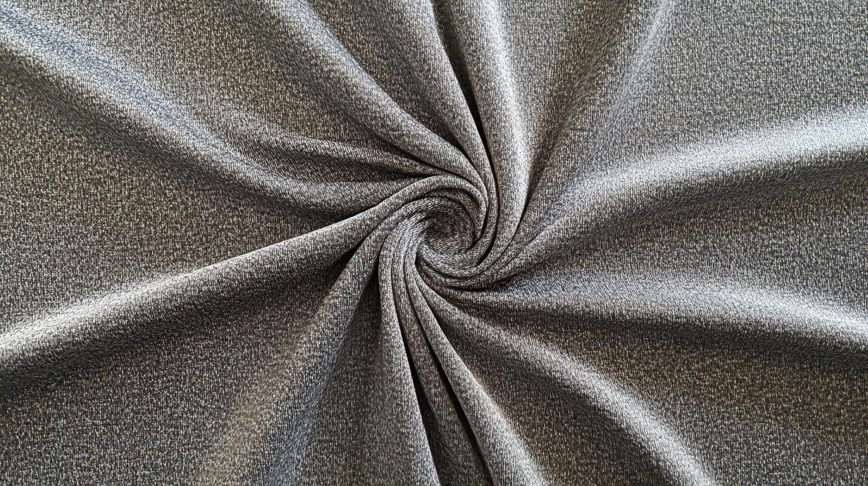 Grey Fabric Swirled in a Circular Pattern photo