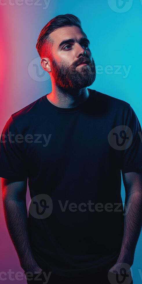 Dynamic portrait of a man with a beard under dramatic lighting photo