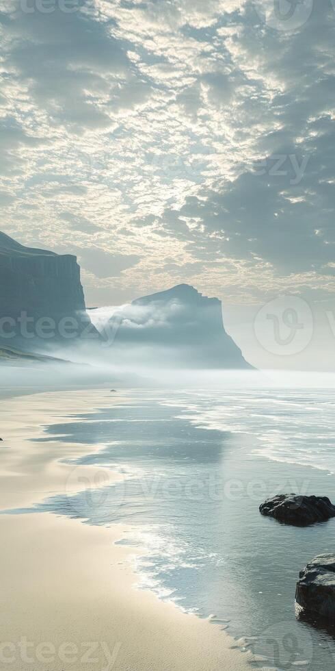 Misty coastal landscape with gentle waves and distant cliffs photo