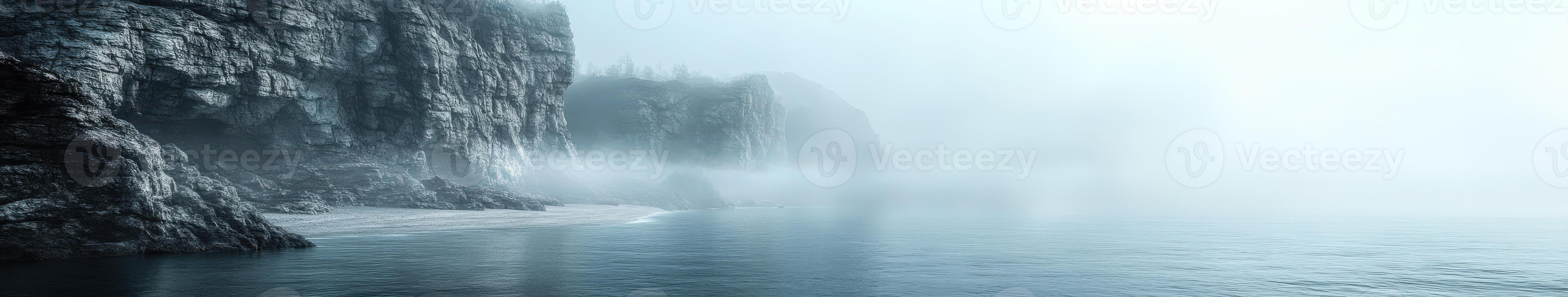 Fog blankets the coastline creating a serene natural landscape photo