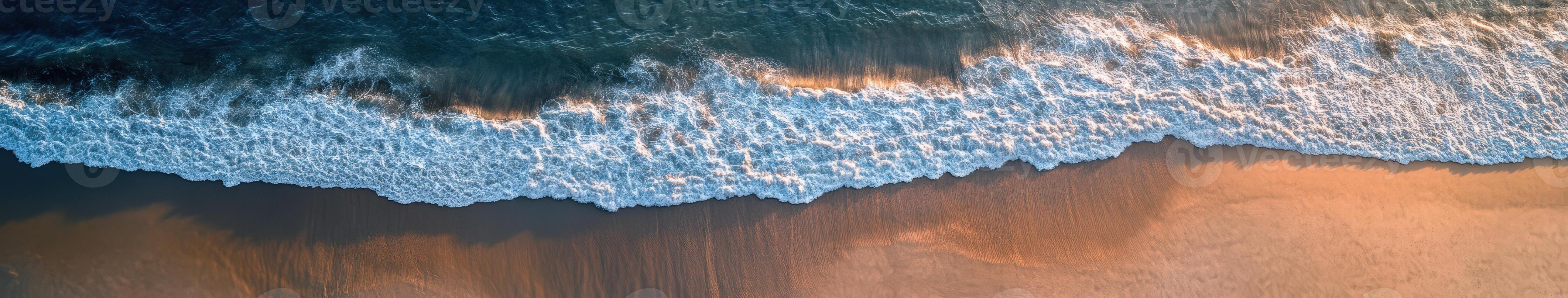 Waves gently lapping on a serene shoreline at sunset photo
