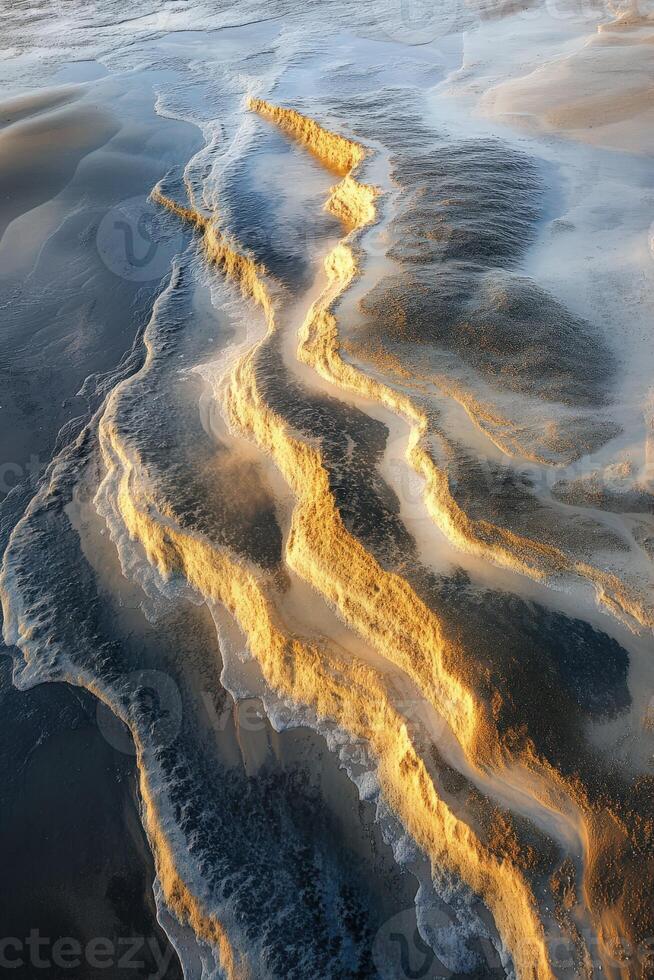 Shimmering shoreline patterns at sunset create stunning visuals photo