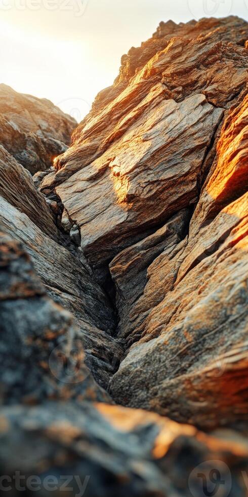 Stunning rocky cliff at sunset photo