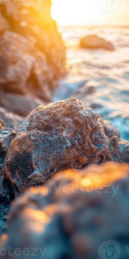 Rocks along a sunlit cliff edge photo