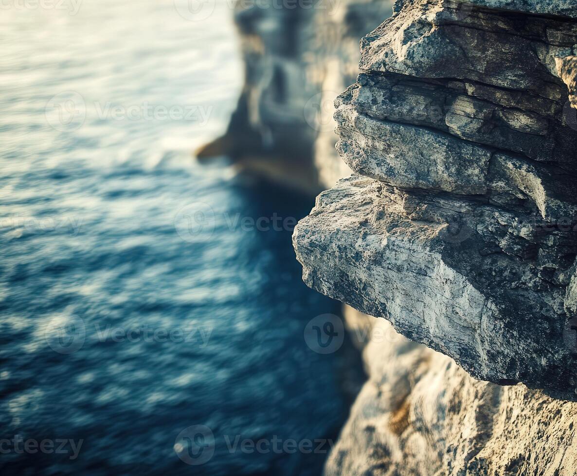 A person standing on the edge of a cliff photo
