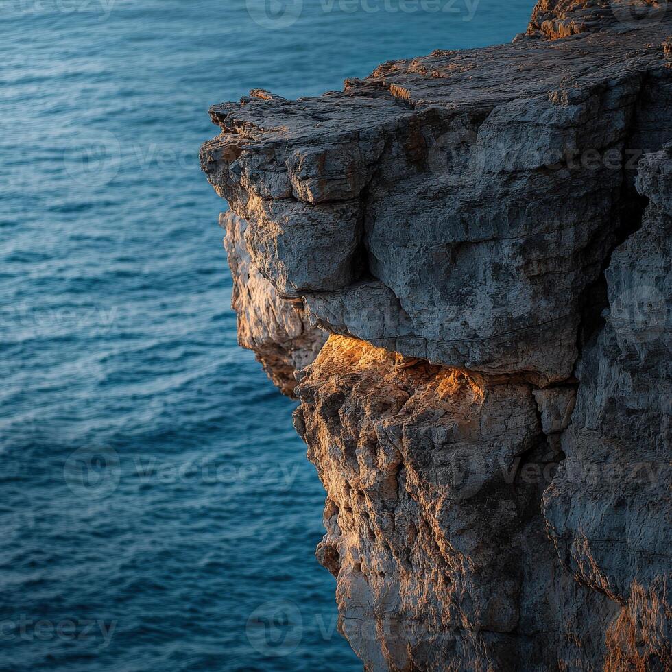 A cliff with a light shining on it photo