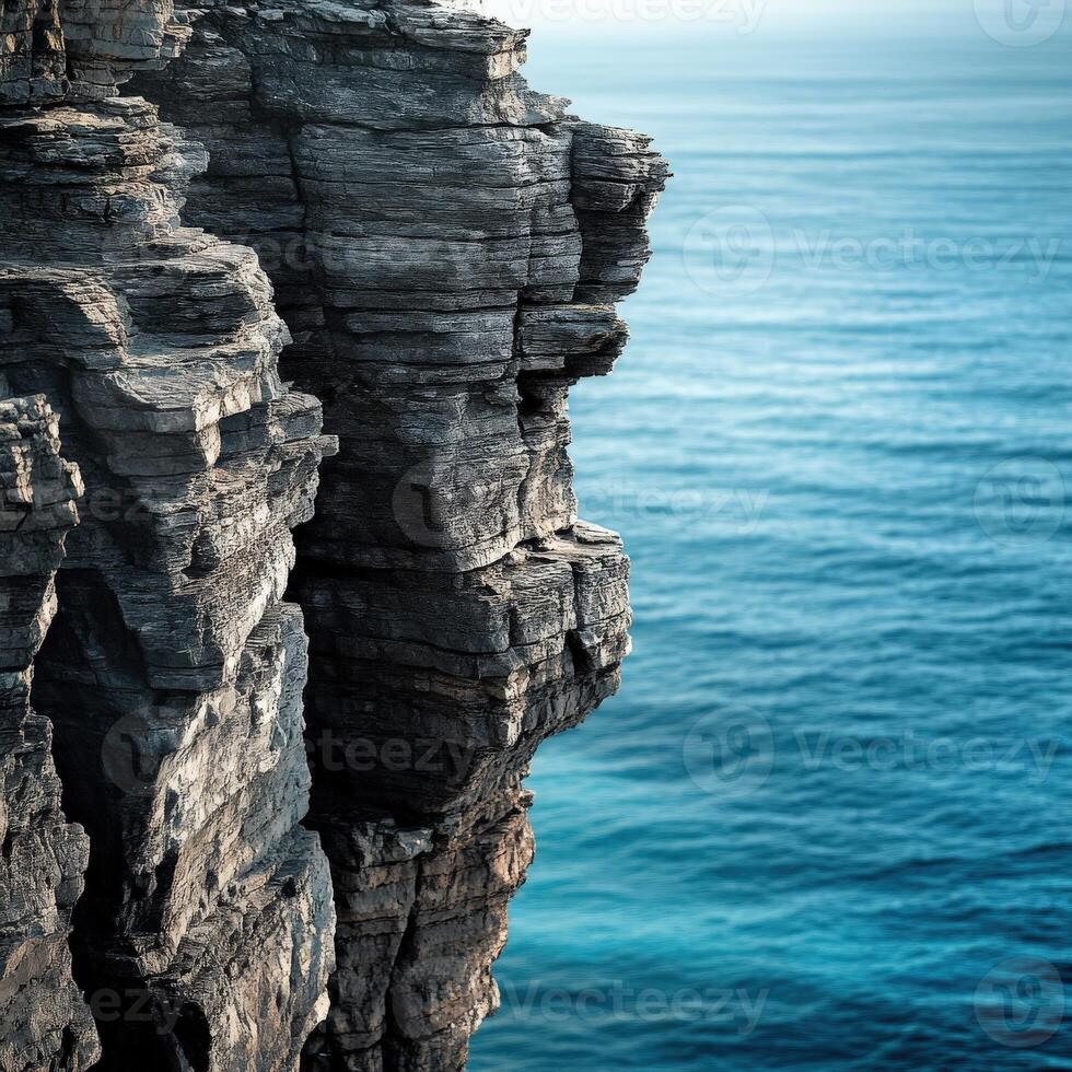 Rocky cliff edge by the sea photo