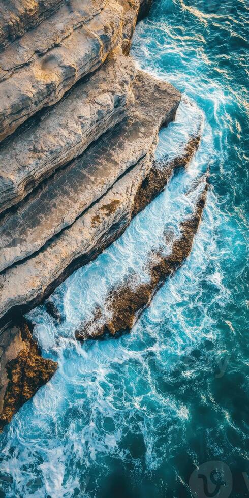 The rocky coast of the sea in the middle of the ocean photo