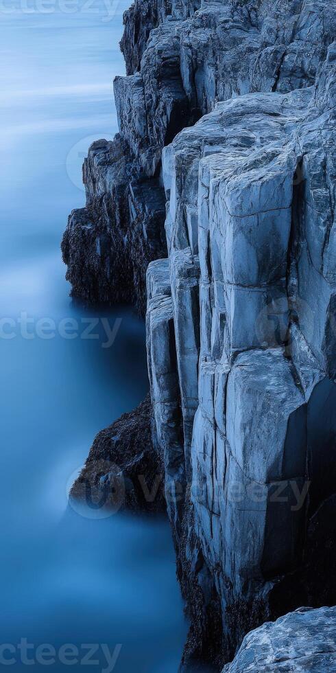 Rocky coastline at twilight photo